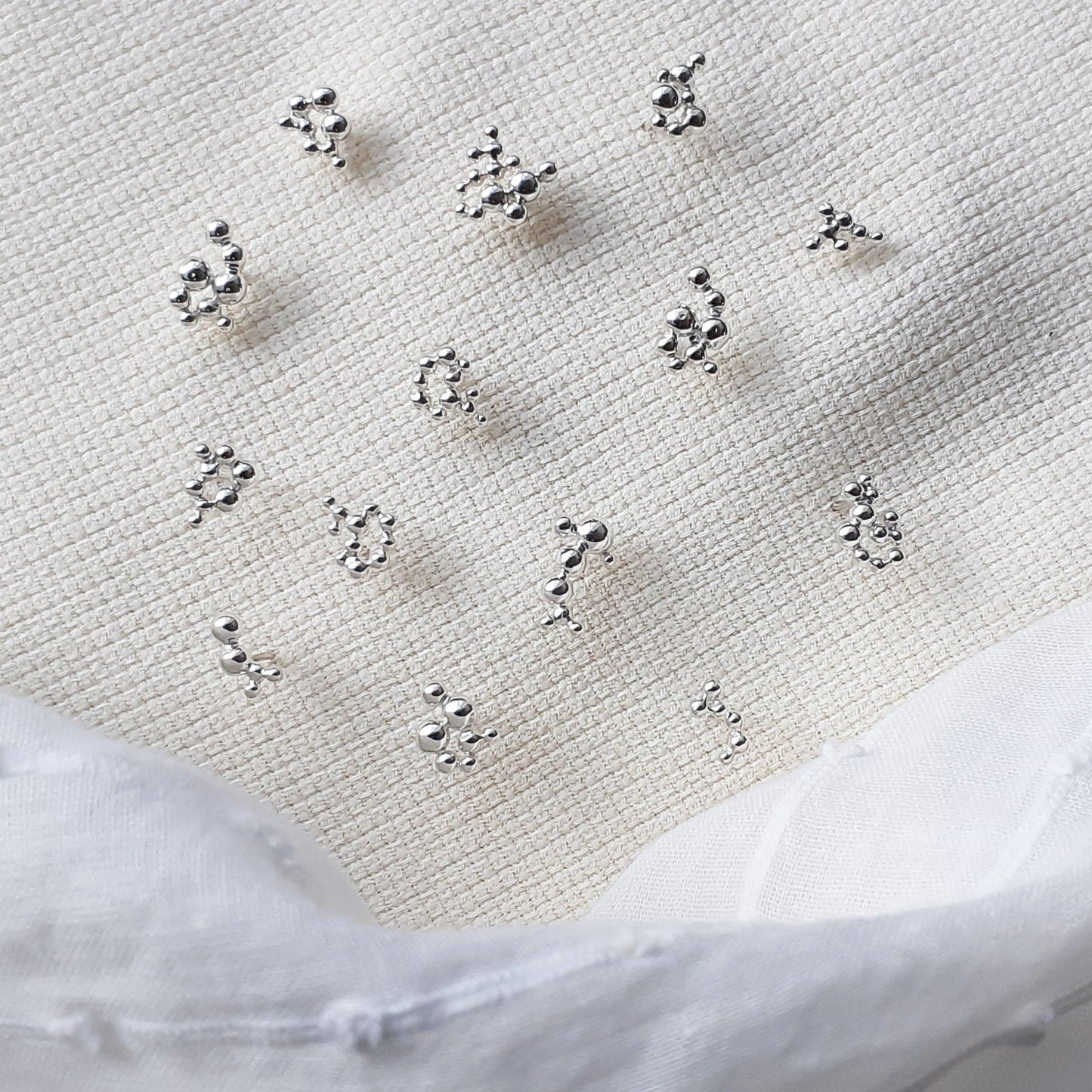 Clust • Boucles asymétriques en argent sterling inspirées des étoiles